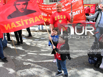 Child with Partizan Flag . International Workers Day in London kicked off with a march through Central London and ended in Trafalgar Square...