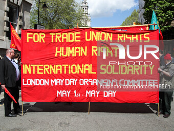 Banner at Mayday . International Workers Day in London kicked off with a march through Central London and ended in Trafalgar Square where th...