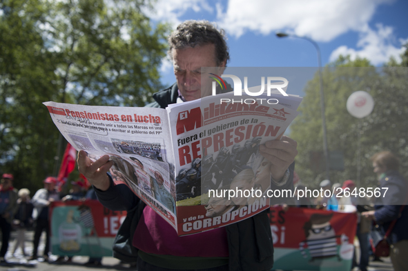 Thousands of people have marched on May Day in Madrid, under the slogan "Time to win: Equality, better employment, higher wages and decent p...