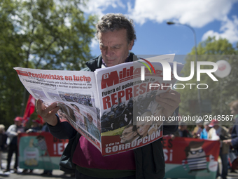 Thousands of people have marched on May Day in Madrid, under the slogan "Time to win: Equality, better employment, higher wages and decent p...