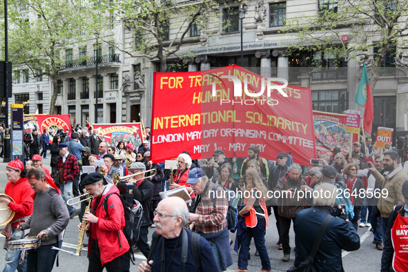 Mayday Marchers head through the Strand . International Workers Day in London kicked off with a march through Central London and ended in Tr...