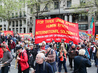 Mayday Marchers head through the Strand . International Workers Day in London kicked off with a march through Central London and ended in Tr...