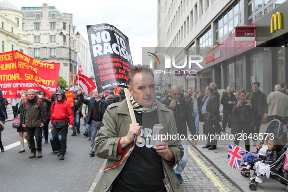 Marcher at Mayday in London . International Workers Day in London kicked off with a march through Central London and ended in Trafalgar Squa...