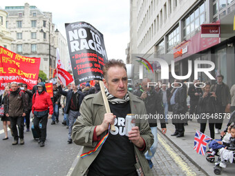 Marcher at Mayday in London . International Workers Day in London kicked off with a march through Central London and ended in Trafalgar Squa...