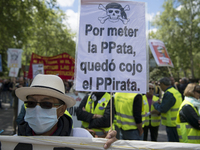 Thousands of people have marched on May Day in Madrid, under the slogan "Time to win: Equality, better employment, higher wages and decent p...