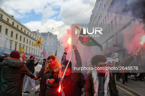 Kurdish protesters set off Flares at Mayday . International Workers Day in London kicked off with a march through Central London and ended i...