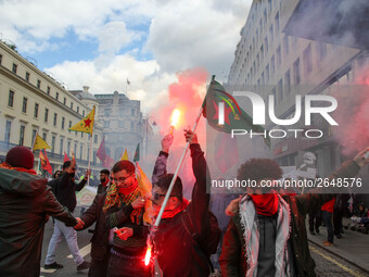 Kurdish protesters set off Flares at Mayday . International Workers Day in London kicked off with a march through Central London and ended i...