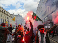 Kurdish protesters set off Flares at Mayday . International Workers Day in London kicked off with a march through Central London and ended i...