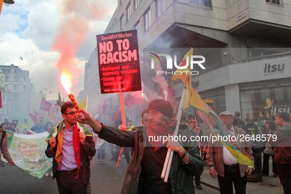 Kurdish protesters set off Flares at Mayday . International Workers Day in London kicked off with a march through Central London and ended i...