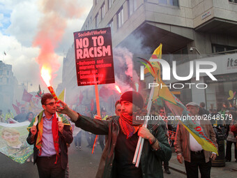 Kurdish protesters set off Flares at Mayday . International Workers Day in London kicked off with a march through Central London and ended i...