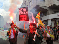 Kurdish protesters set off Flares at Mayday . International Workers Day in London kicked off with a march through Central London and ended i...