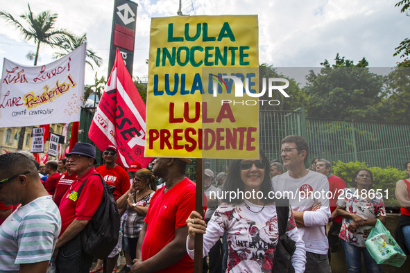 Supporters of the Workers' Party founder and Brazilian ex-president (2003-2011) Luiz Inacio Lula da Silva take part in a May Day rally at Re...