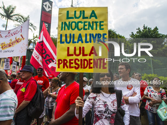 Supporters of the Workers' Party founder and Brazilian ex-president (2003-2011) Luiz Inacio Lula da Silva take part in a May Day rally at Re...