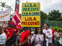 Supporters of the Workers' Party founder and Brazilian ex-president (2003-2011) Luiz Inacio Lula da Silva take part in a May Day rally at Re...