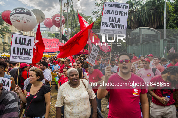 Supporters of the Workers' Party founder and Brazilian ex-president (2003-2011) Luiz Inacio Lula da Silva take part in a May Day rally at Re...