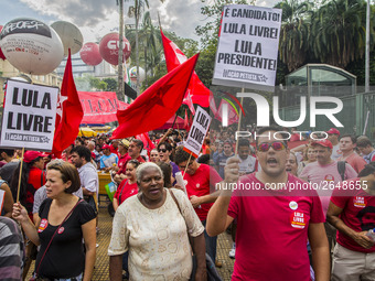 Supporters of the Workers' Party founder and Brazilian ex-president (2003-2011) Luiz Inacio Lula da Silva take part in a May Day rally at Re...