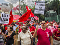 Supporters of the Workers' Party founder and Brazilian ex-president (2003-2011) Luiz Inacio Lula da Silva take part in a May Day rally at Re...