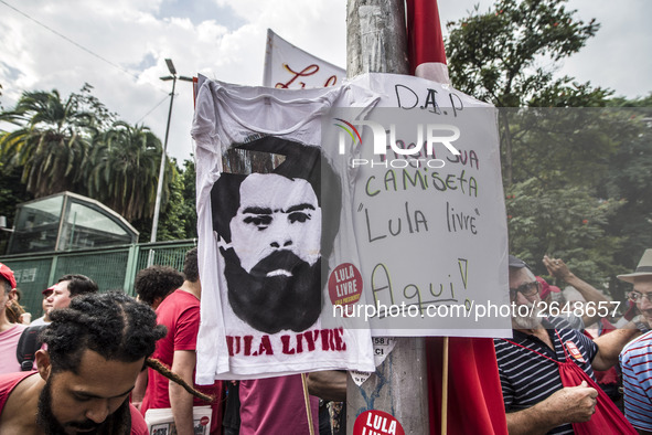 Supporters of the Workers' Party founder and Brazilian ex-president (2003-2011) Luiz Inacio Lula da Silva take part in a May Day rally at Re...