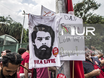 Supporters of the Workers' Party founder and Brazilian ex-president (2003-2011) Luiz Inacio Lula da Silva take part in a May Day rally at Re...