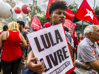 Supporters of the Workers' Party founder and Brazilian ex-president (2003-2011) Luiz Inacio Lula da Silva take part in a May Day rally at Re...