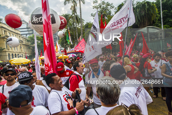 Supporters of the Workers' Party founder and Brazilian ex-president (2003-2011) Luiz Inacio Lula da Silva take part in a May Day rally at Re...