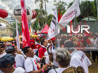 Supporters of the Workers' Party founder and Brazilian ex-president (2003-2011) Luiz Inacio Lula da Silva take part in a May Day rally at Re...