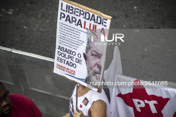 Supporters of the Workers' Party founder and Brazilian ex-president (2003-2011) Luiz Inacio Lula da Silva take part in a May Day rally at Re...