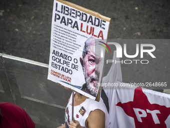 Supporters of the Workers' Party founder and Brazilian ex-president (2003-2011) Luiz Inacio Lula da Silva take part in a May Day rally at Re...