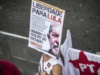 Supporters of the Workers' Party founder and Brazilian ex-president (2003-2011) Luiz Inacio Lula da Silva take part in a May Day rally at Re...