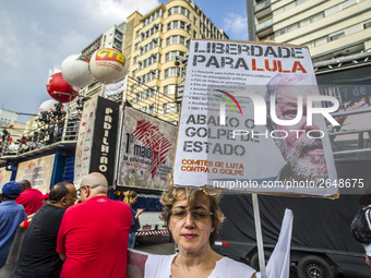 Supporters of the Workers' Party founder and Brazilian ex-president (2003-2011) Luiz Inacio Lula da Silva take part in a May Day rally at Re...