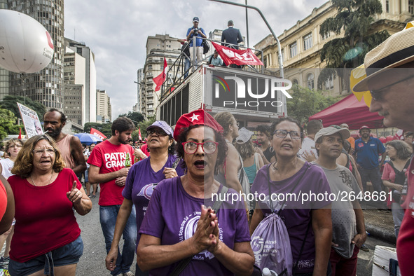 Supporters of the Workers' Party founder and Brazilian ex-president (2003-2011) Luiz Inacio Lula da Silva take part in a May Day rally at Re...