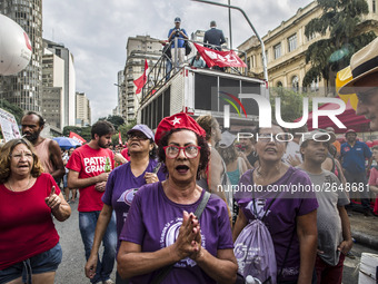 Supporters of the Workers' Party founder and Brazilian ex-president (2003-2011) Luiz Inacio Lula da Silva take part in a May Day rally at Re...