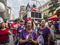 Supporters of the Workers' Party founder and Brazilian ex-president (2003-2011) Luiz Inacio Lula da Silva take part in a May Day rally at Re...