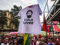 Supporters of the Workers' Party founder and Brazilian ex-president (2003-2011) Luiz Inacio Lula da Silva take part in a May Day rally at Re...