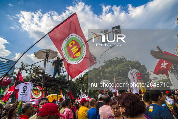 Supporters of the Workers' Party founder and Brazilian ex-president (2003-2011) Luiz Inacio Lula da Silva take part in a May Day rally at Re...