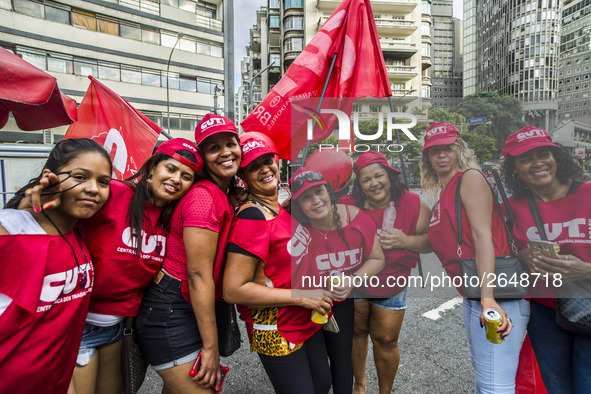 Supporters of the Workers' Party founder and Brazilian ex-president (2003-2011) Luiz Inacio Lula da Silva take part in a May Day rally at Re...