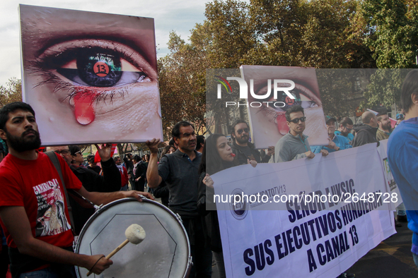 Chilean workers take part in a May Day march in Santiago on May 1, 2018. 