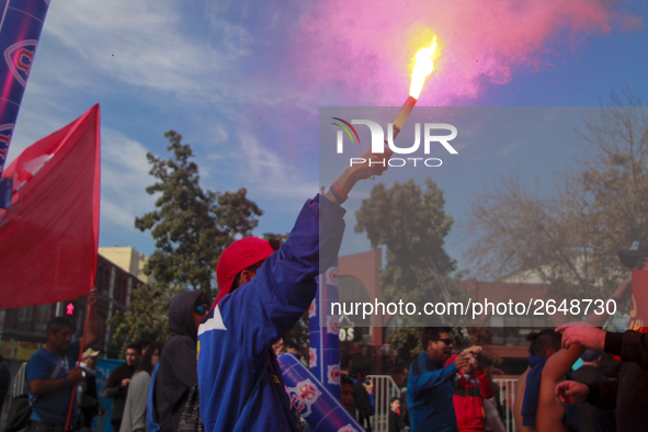 Chilean workers take part in a May Day march in Santiago on May 1, 2018. 