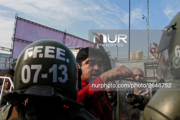 Chilean workers take part in a May Day march in Santiago on May 1, 2018. 