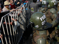 Chilean workers take part in a May Day march in Santiago on May 1, 2018. (