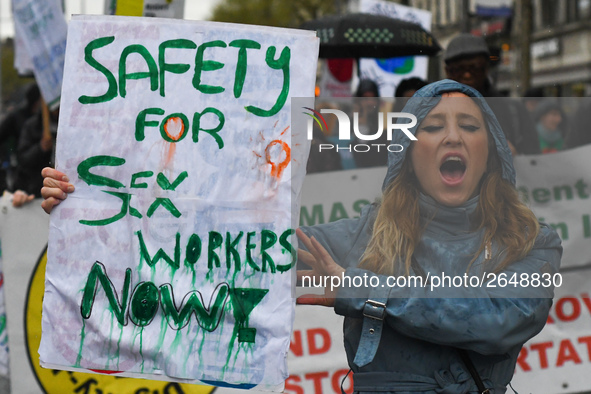 A young woman holds 'Safety for Sex Workers Now!' sign during an annual May Day march for workers' rights.
On Tuesday, May 1, 2018, in Dubli...