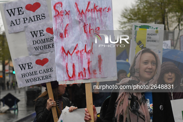 A young woman holds 'Sex Workers of the World Unite!' sign during an annual May Day march for workers' rights.
On Tuesday, May 1, 2018, in D...