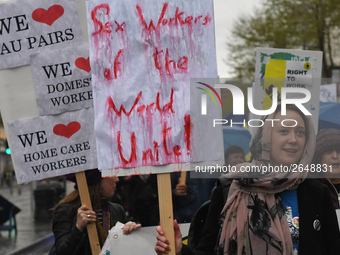 A young woman holds 'Sex Workers of the World Unite!' sign during an annual May Day march for workers' rights.
On Tuesday, May 1, 2018, in D...