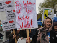 A young woman holds 'Sex Workers of the World Unite!' sign during an annual May Day march for workers' rights.
On Tuesday, May 1, 2018, in D...