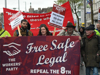 Members of the Workers' Party carry 'Free Safe Legal' banner during an annual May Day march for workers' rights.
On Tuesday, May 1, 2018, in...