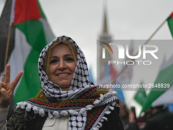 An activist from Ireland Palestine Solidarity Campaign joins hundreds of people including SIPTU unions, Right2Work campaigners, members of S...