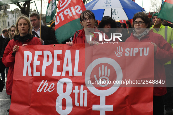 Members of SIPTU union hold 'Repeal the 8th' banner as they join hundreds of people including SIPTU unions, Right2Work campaigners, members...