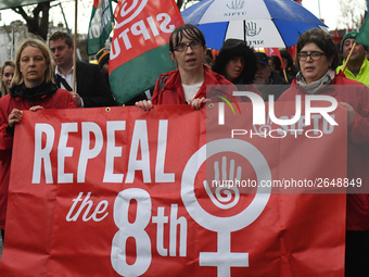 Members of SIPTU union hold 'Repeal the 8th' banner as they join hundreds of people including SIPTU unions, Right2Work campaigners, members...