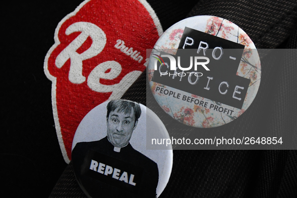 Pro-Choice, Repeal and Father Dougal Repeal signs during a march, as Hundreds of people including SIPTU unions, Right2Work campaigners, memb...