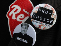 Pro-Choice, Repeal and Father Dougal Repeal signs during a march, as Hundreds of people including SIPTU unions, Right2Work campaigners, memb...